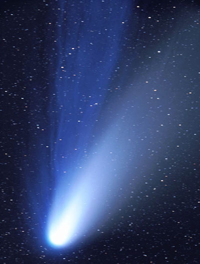Image of a blue comet with Dust and ion tails of Comet Hale-Bopp